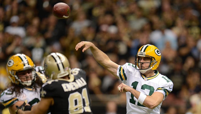 Green Bay Packers quarterback Aaron Rodgers (12) makes a pass against the New Orleans Saints during Sunday night's game at the Superdome in New Orleans. Evan Siegle/Press-Gazette Media