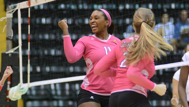 Rachel Johnson celebrates a point with teammates during a game played Oct. 25 against UAB.