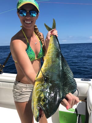 Mahi madness is upon the Treasure Coast and Space Coast. Melissa Fox of Stuart caught this dolphin - commonly called mahi mahi - while trolling Easter Sunday with her dad Leonard Fox in 280 feet of water off St. Lucie Inlet.