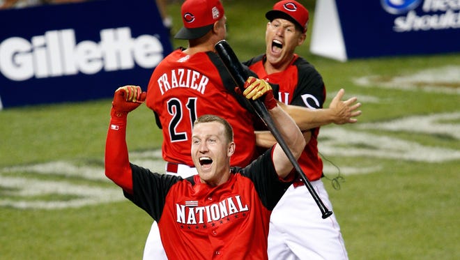 Todd Frazier (front) celebrates with his brothers Jeff and Charlie (right) after winning the Home Run Derby last July.