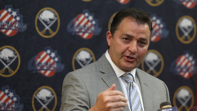 New Amerks coach Dan Lambert is keeping goalie coach Bob Janosz but told holdover assistant coaches Chris Taylor and Paul Fixter that they no longer have jobs.