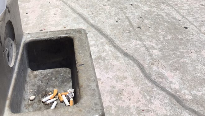 Ashtrays are located 20 feet from the main entrance to the El Paso County Courthouse. The county is banning smoking in all county buildings and parks, except Ascarate Golf Course and the El Paso County Coliseum, starting Jan. 1.