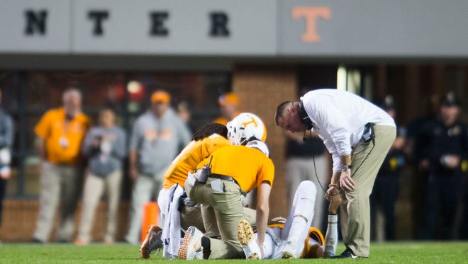Tennessee Head Coach Butch Jones looks over Tennessee quarterback during a game between Tennessee and Southern Miss at Neyland Stadium in Knoxville, Tennessee, on Saturday, Nov. 4, 2017.