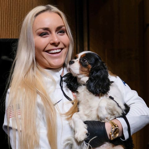 Lindsey Vonn holds her dog Lucy after a news  conf