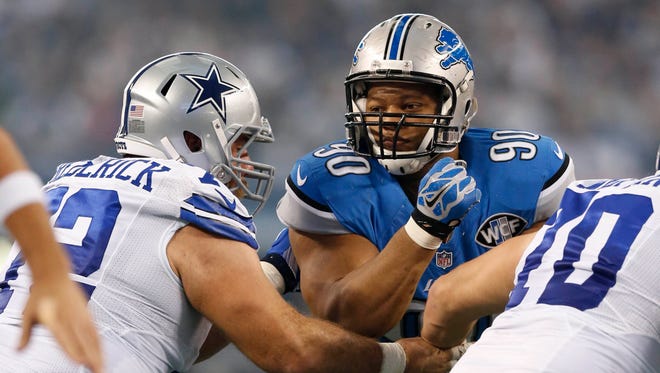 Detroit Lions defensive tackle Ndamukong Suh is blocked by the Dallas Cowboys.