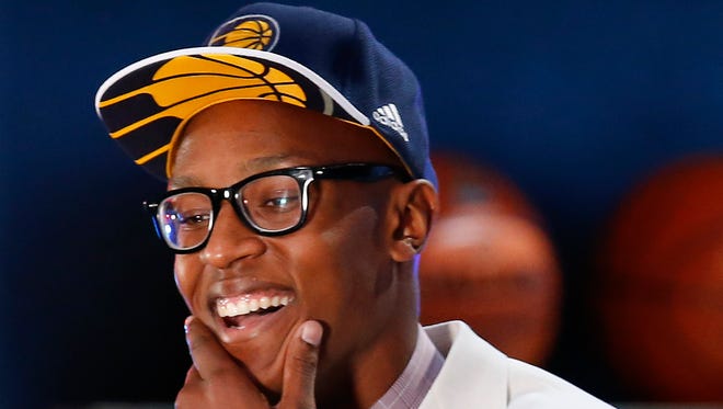 Myles Turner reacts after being selected 10th overall by the Indiana Pacers during the NBA basketball draft, Thursday, June 25, 2015, in New York. (AP Photo/Kathy Willens) 