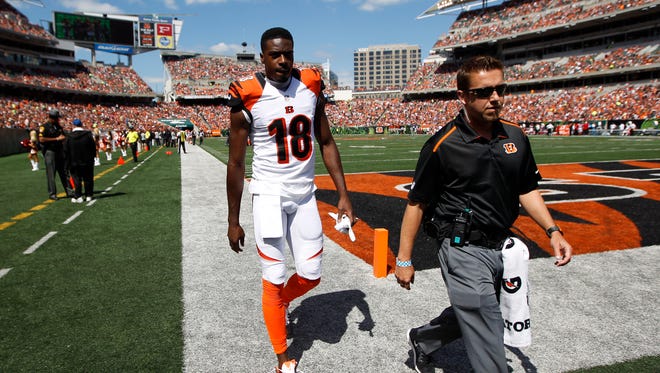 Bengals wide receiver A.J. Green walks off the field with an injured toe Sept. 14.