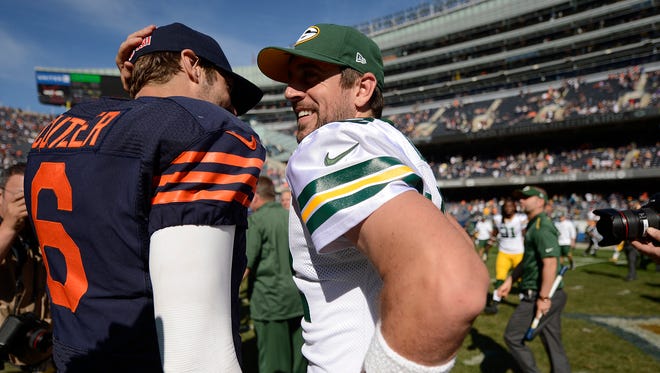 Aaron Rodgers and Jay Cutler meet at midfield after the Packers beat the Bears on Sept. 28, 2014.
