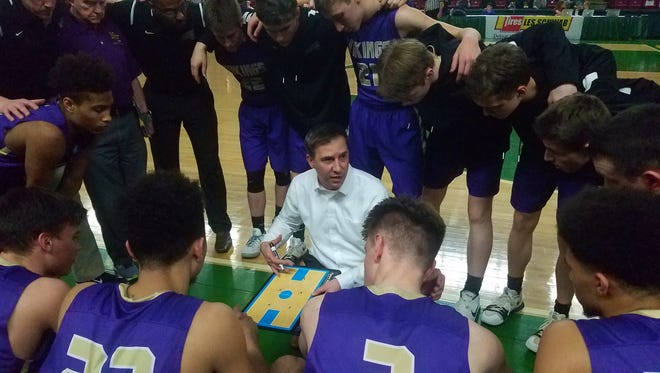 North Kitsap boys basketball coach Scott Orness talks to his team during Wednesday's state tournament game against W.F. West.