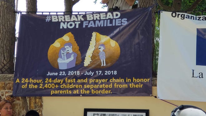 A sign calls for an end to separation of families at a rally at Archer Park Wednesday, June 27, 2018, sponsored by the RFK Foundation  in McAllen, Texas.