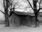 One-Room School Now a Warehouse - Built in the mid 1800's for 13 children of neighboring farmers, this one-room red brick structure was called Penfield Station School. The name was changed to Despatch District 9 School when the Village of Despatch was founded in 1897, and abandoned in 1898 when a roster of 60 pupils necessitated building of Union Free School. Located on Washington Street, it is used by the A. H. Bown estate for storage. (Staff photo) TU 5/26/1947
