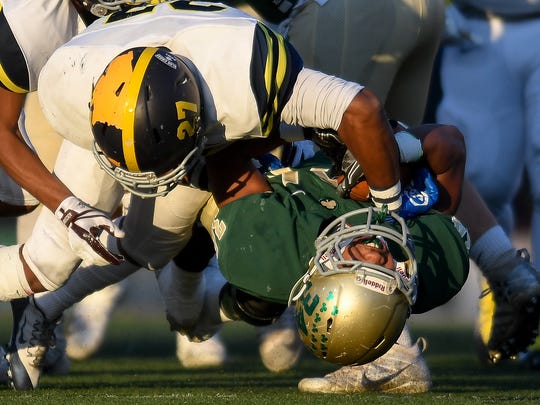 Notre Dame's Jeffrey Watkins (34) is tackled for a