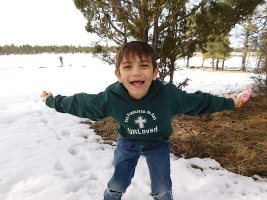 Eight-year-old Acis Raiden Garcia is looking for the Good Samaritan he said saved his life when he was swept away in the flash-flood in Payson.