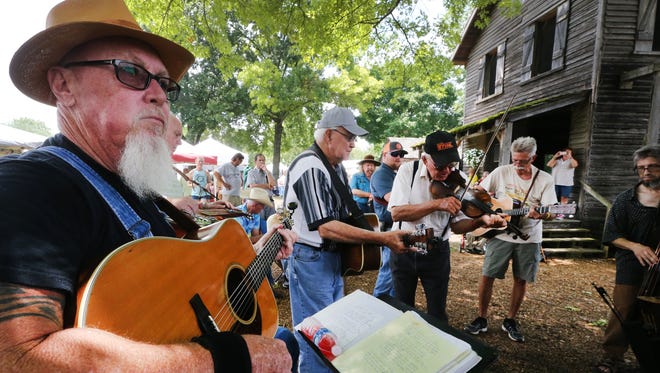 (L to R) Don Hazelwood, J.T. Langley, Billy Hazelwood, Mike Singleton and Samuel Louis Morgan play during a jam session next to the Mill at Cannonsburgh Village at the 39th Annual Uncle Dave Macon Days Festival, on Saturday, July 09, 2016.