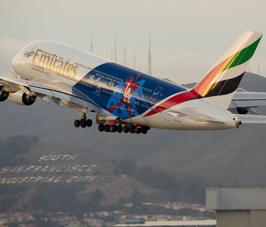 An Emirates Airbus A380, emblazoned with a special Los Angeles Dodgers livery, departs for Dubai from San Francisco International Airport on Oct. 23, 2016.