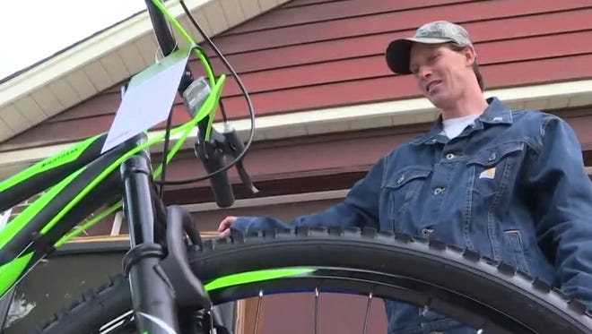 Michael Kapaun's bike was stolen while he stood with a flag for hours near the scene where Adam's County Deputy Heath Gumm was killed. When deputies heard his story, they came to his aid.