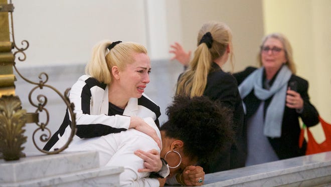 Bill Cosby accusers (L-R) Caroline Heldman, Lili Bernard and Victoria Valentino (far right) react after the guilty on all counts verdict was delivered in the Cosby retrial.