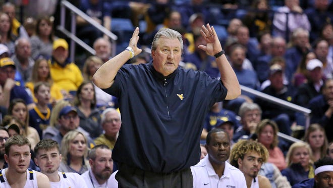 West Virginia coach Bob Huggins reacts to a call during the second half of the team's NCAA college basketball game against Oklahoma State on Tuesday, Feb. 18, 2020, in Morgantown, W.Va. (AP Photo/Kathleen Batten)