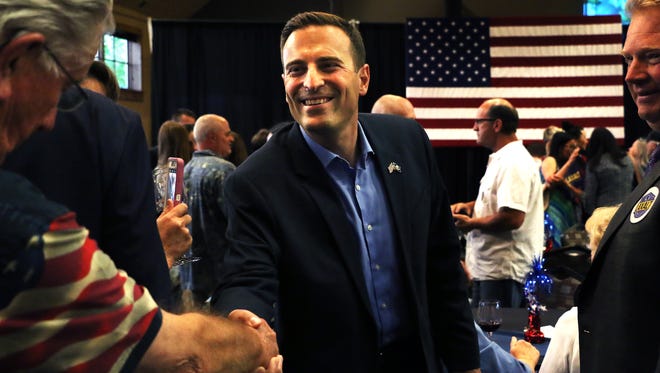 Republican candidate for Nevada Governor Adam Laxalt greets supporters at The Grove in Reno on June 12, 2018.