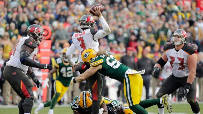 Green Bay Packers outside linebacker Clay Matthews (52) sacks Tampa Bay Buccaneers quarterback Jameis Winston (3) in the fourth quarter at Lambeau Field on Sunday, December 3, 2017 in Green Bay, Wis.