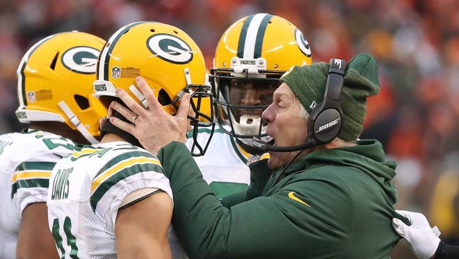 Green Bay Packers wide receiver Trevor Davis (11) gets congratulations from special teams coach Ron Zook after a long punt return against the Cleveland Browns on Dec. 10, 2017 at FirstEnergy Stadium in Cleveland.