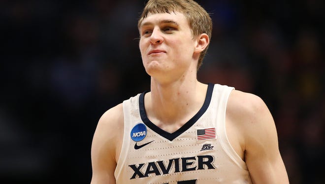 Xavier Musketeers guard J.P. Macura (55) smiles in the second half.