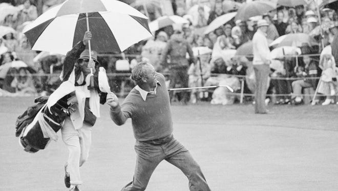 Arnold Palmer sails his visor into the crowd at the 18th green at Bermuda Dunes after knocking in a birdie putt that clinched victory for him on Sunday, Feb. 11, 1973 in the Bob Hope Desert Golf Classic in Palm Springs. It was his first tournament victory in a year and a half.