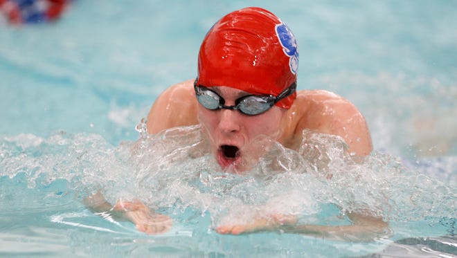 Fairport's Connor O'Shea does the great stroke during the 200 medley relay against Pittsford. 