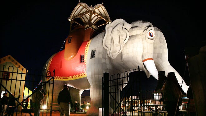 Margate landmark Lucy the Elephant is bathed in spotlights Tuesday to commemorate the one-year anniversary of Superstorm Sandy hitting the Jersey Shore. Sandy made landfall at 7:30 p.m. Oct. 29, 2012, sending floodwaters pouring across the region's coastline.