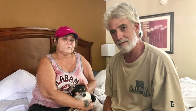 Arlene Thompson, her partner Robert Schmidt and their Chihuahua barely escaped a forest fire Sunday in Eastpoint. They’re staying in a motel for the time being.