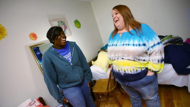 Karneisha Cox, left, 19, shares a laugh with house mom Deborah Ainsworth at a Joyce's Hope Home in south Jackson.