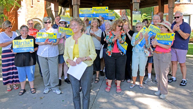 
Martha Robertson of Dryden, Democratic challenger for the 23rd Congressional District, acknowledges her supporters with a smile during a campaign event in September at Wisner Park in Elmira. 
