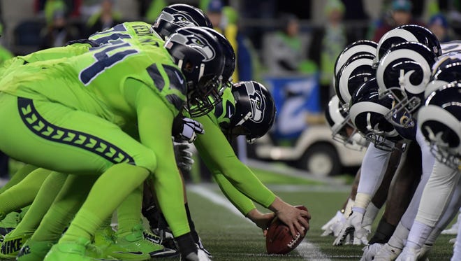 General overall view of the line of scrimmage as Seattle Seahawks long snapper Nolan Frese (48) snaps the ball against the Los Angeles Rams during a NFL football game at CenturyLink Field.