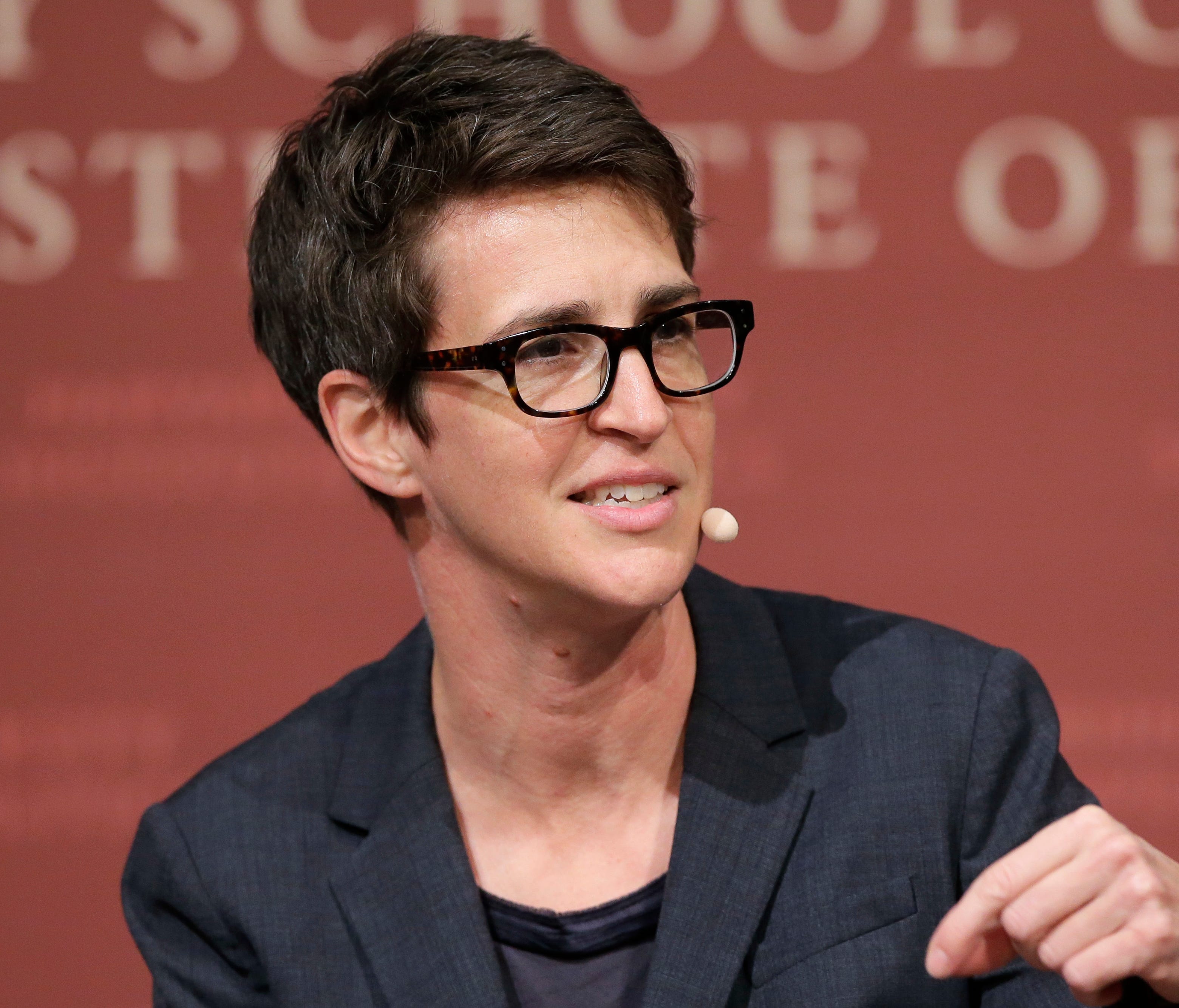 MSNBC political commentator Rachel Maddow is pictured moderating a forum panel at the John F. Kennedy School of Government at  Harvard University.