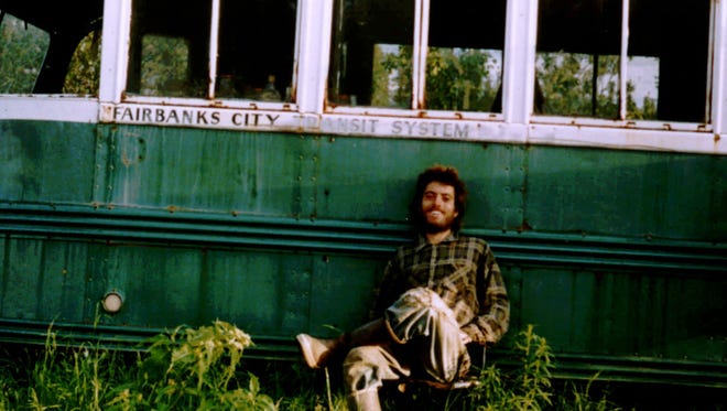 Chris McCandless sits by an abandoned bus in the Alaskan wilderness in this 1992 self-portrait.