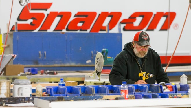 Jeff Stone constructs a shelf to be used in a truck made for a Snap-on franchisee at LDV Inc. in Burlington.