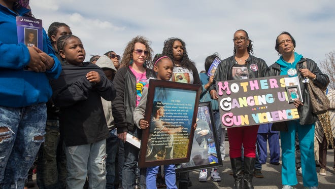 Attendees of a rally at North United Methodist Church addressing unsolved murders in Indianapolis, co-sponsored by the Ten Point Coalition, Indianapolis, Sunday, March 20, 2016. 