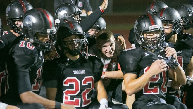 Phoenix Paradise Valley football players celebrate their win after their high school football game against Laveen Betty Fairfax in Phoenix on Friday, August 28, 2015.