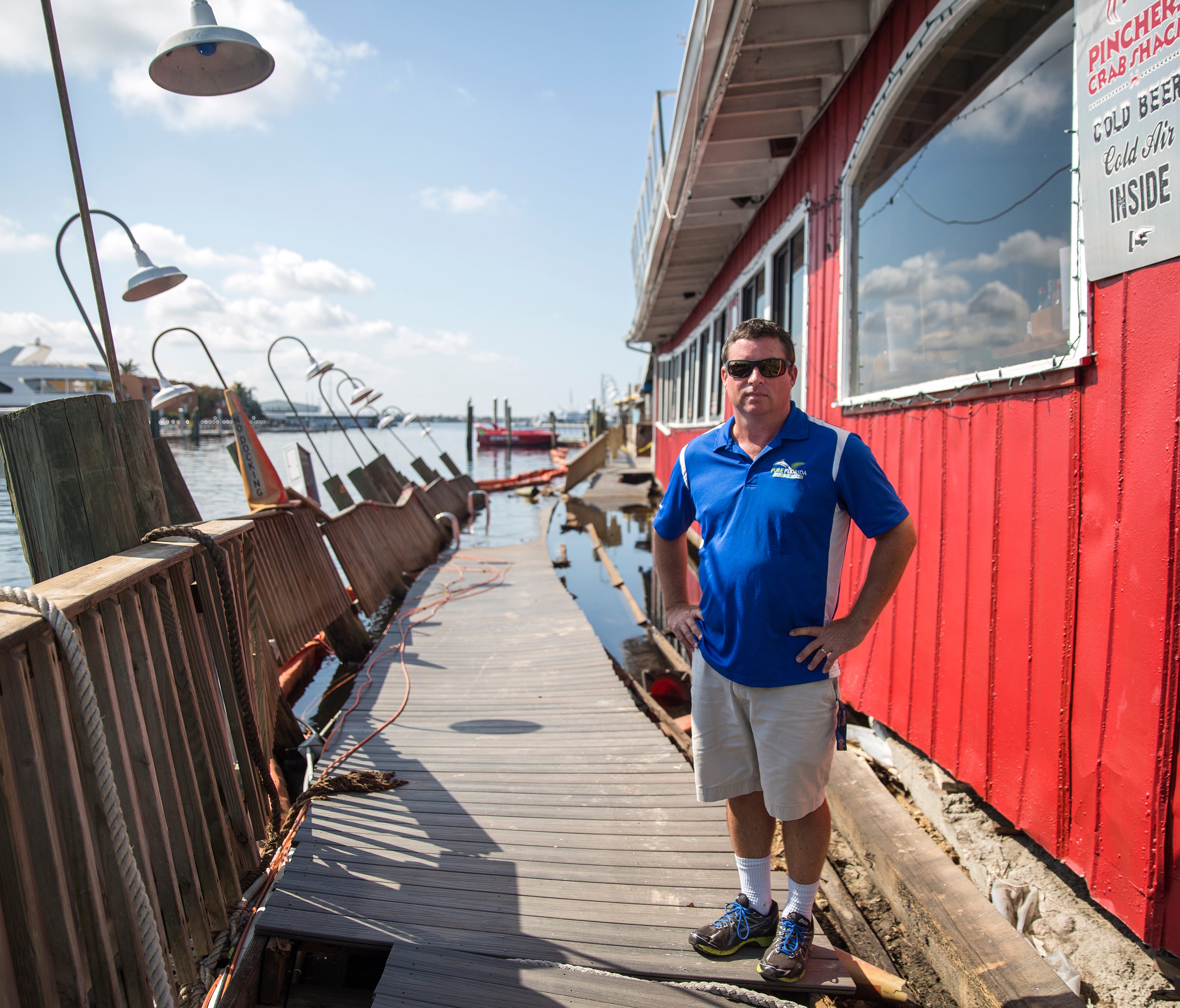 Captain Harry Julian, a founder of Pure Florida boat tours, stands by one of his docks on Tuesday, Sept. 19, 2017, that was left destroyed by Hurricane Irma at Tin City, a popular spot for tourists. The business also sustained damage to its water ves