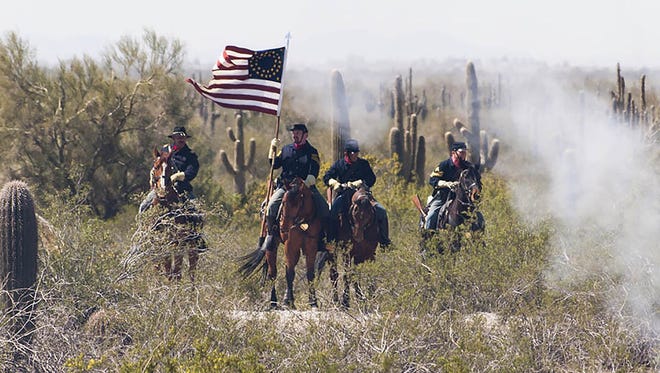 A large group of volunteers has headed to Picacho Peak State Park near Eloy to re-enact three Civil War battles.