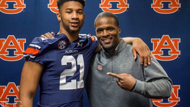 Four-star 2018 Georgia linebacker Michael Harris poses for a picture with Auburn linebackers coach Travis Williams during a recruiting visit.