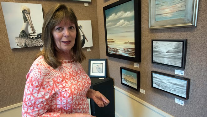 Artist Kathy Sheppard, spends Monday, June 11, 2018, preparing for her 40th-anniversary show at the Quayside Art Gallery.