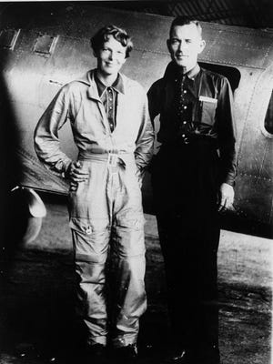 Amelia Earhart and her navigator, Fred Noonan, in front of their twin-engine Lockheed Electra in Los Angeles at the end of May 1937.