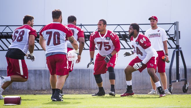 Arizona Cardinals offensive linemen practice at the Tempe facility, Tuesday, May 30, 2017. From left to right are; Jared Veldheer, Evan Boehm, Jonathan McLaughlin, Ulrick John and Dorian Johnson.