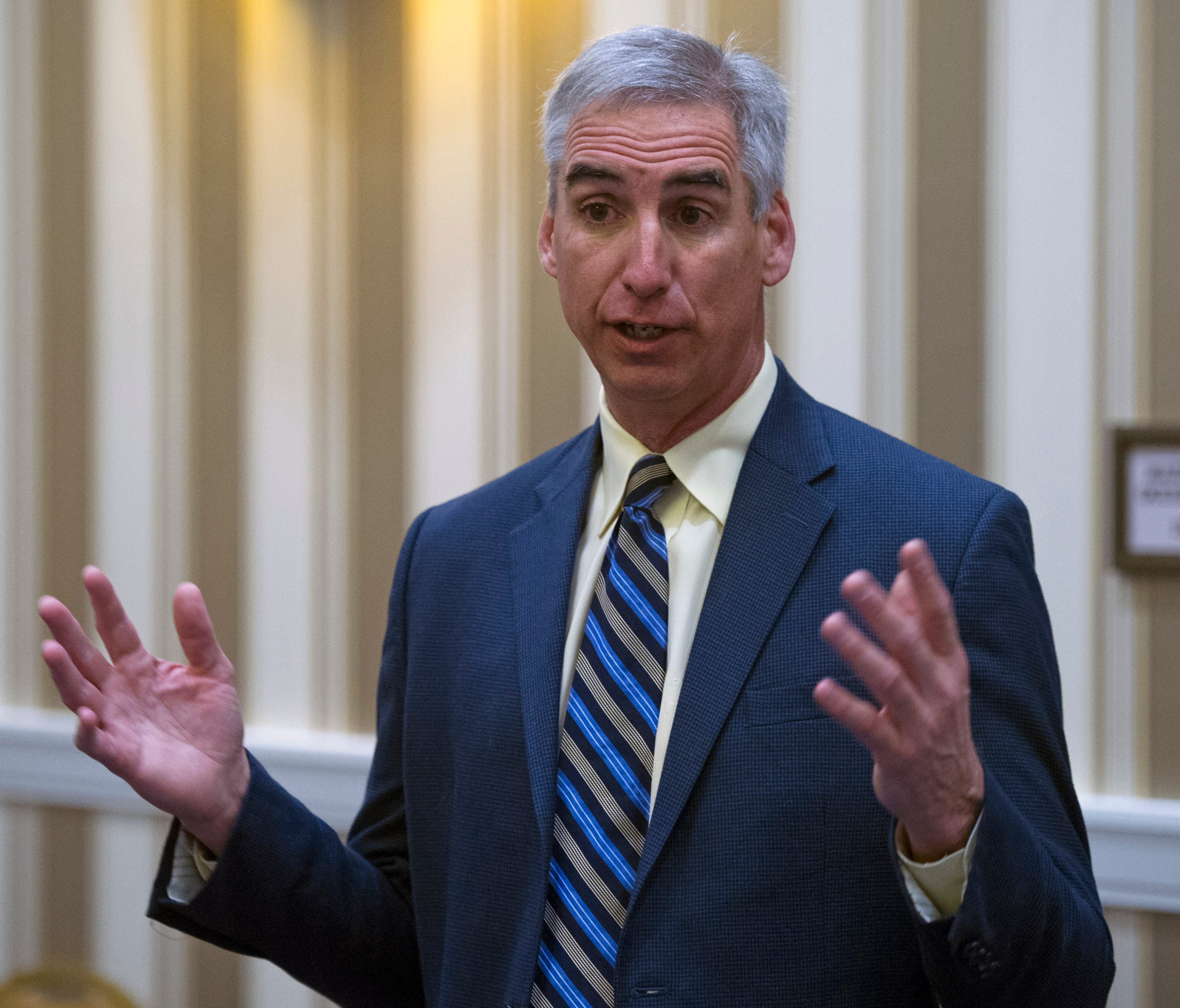 Oliver Luck speaks with members of the media at the NCAA Convention in Oxon, Md., Friday, Jan. 16, 2015. Former West Virginia athletic director and selection committee member  Oliver Luck says the College Football Playoff should stay at four. Now wit