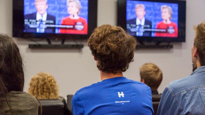 Students watch the first presidential debate at the Micheal O. Leavitt Center for Politics and Public Service at Southern Utah University on Monday, Sept. 26, 2016.