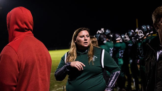 Fairfield athletic director Crystal Heller works on the sidelines Friday night Oct. 14, 2016 during Fairfield High School's Friday night football game against York County Tech.