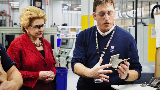 Senator Debbie Stabenow watches Operations Leader Chris Beckley explains how this part helps cool the GE90 engine at Johnson Technology's Brilliant Factory, May 1, 2017, in Norton Shores. Johnson Technology, a subsidiary of GE Aviation, says it’s hired 90 people since fall 2016.