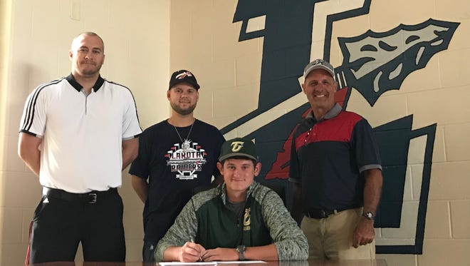 Lakota's Tyler Wehrle announces plans to continue his baseball career at Tiffin University. He's joined by former Raiders coach Drew Linder, his assistant Nate Kerr and Lakota athletic director Kevin Yeckley.
