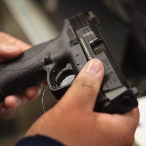 A customer shops for a pistol.